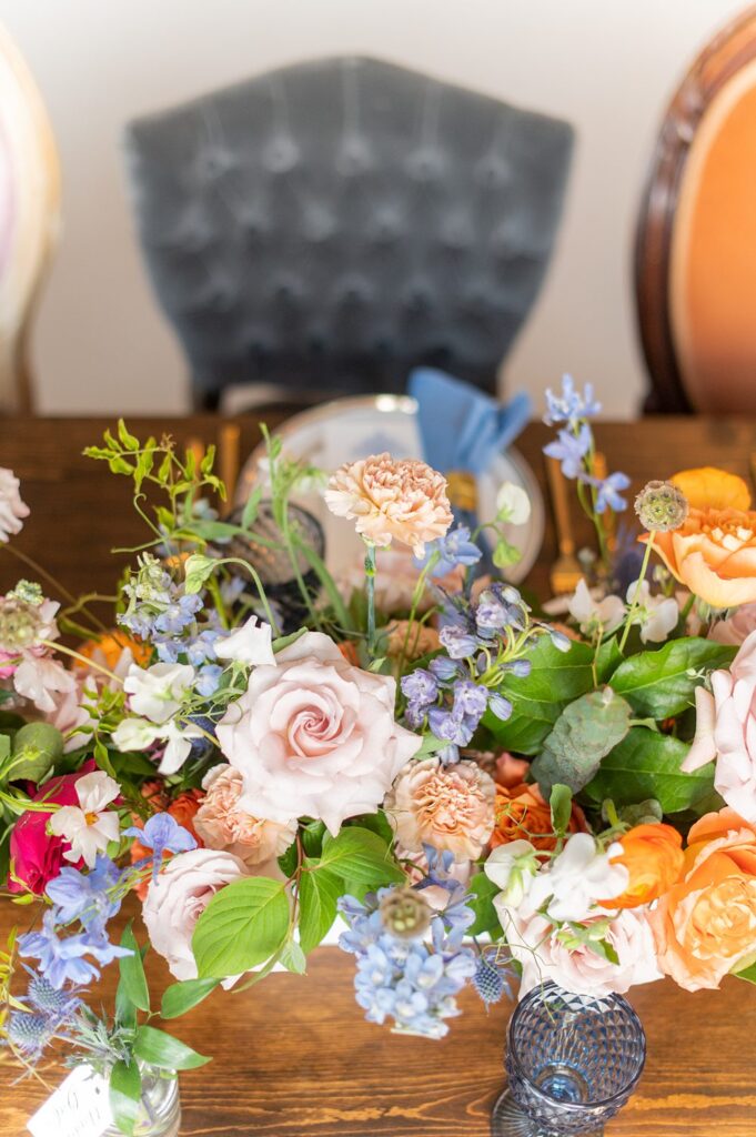 Colorful reception table with orange, blue, pink and green.