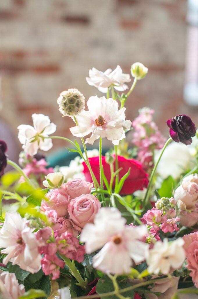 Colorful flowers by Wild Flora Flowers at an Indian wedding at The Graham Mill in NC.