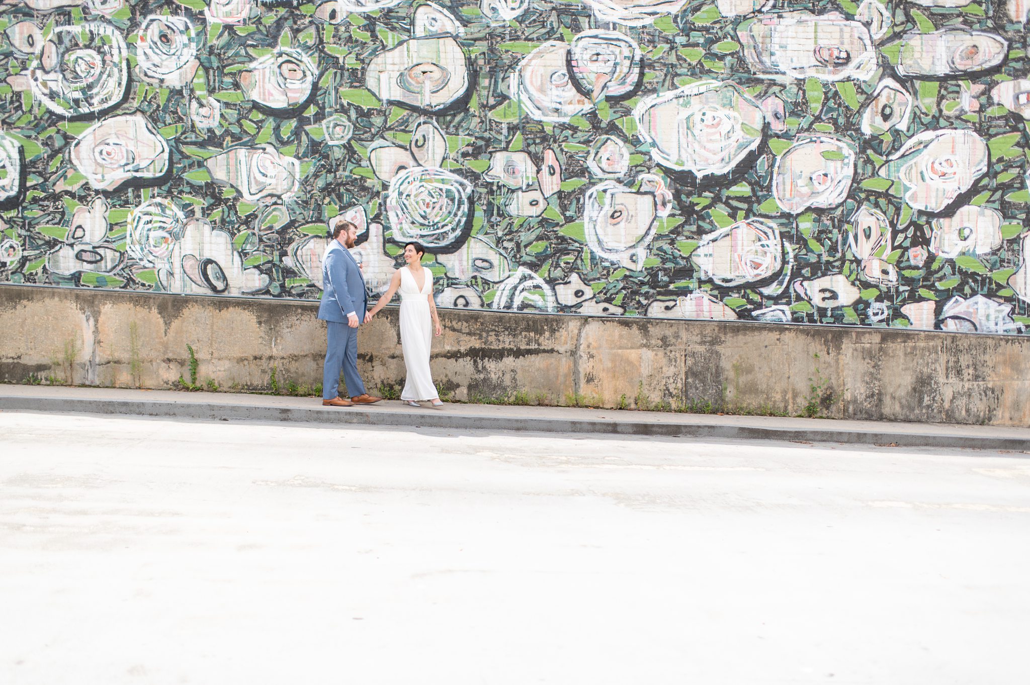 Downtown Raleigh wedding with colorful murals by Mikkel Paige Photography.