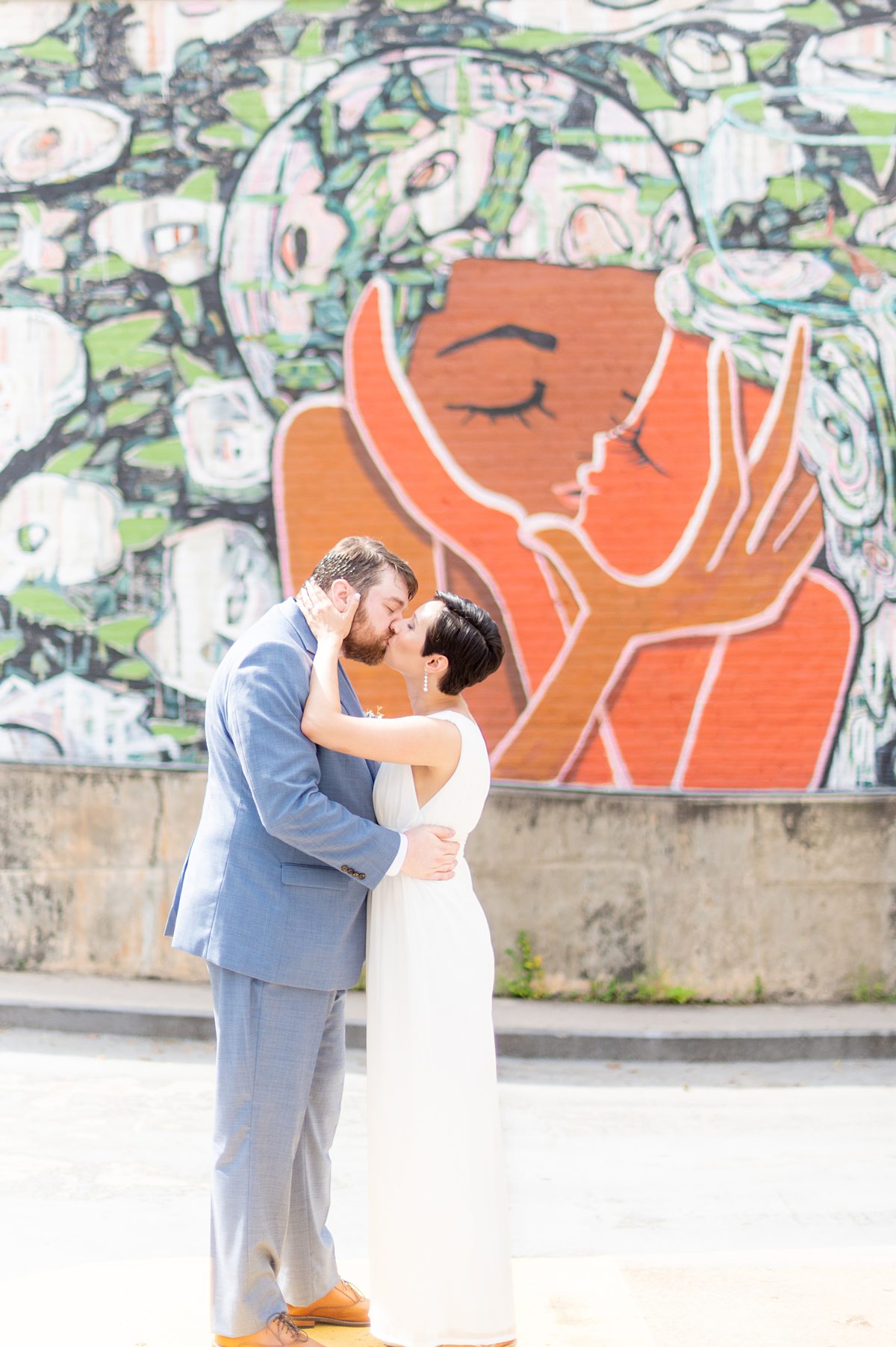 Downtown Raleigh wedding with colorful murals by Mikkel Paige Photography.