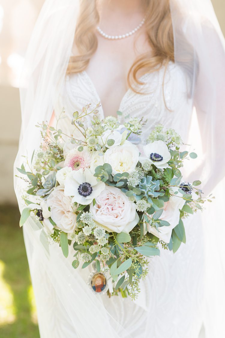 Bouquet of flowers for the bride with anemones, eucalyptus and roses in Sleepy Hollow, NY.