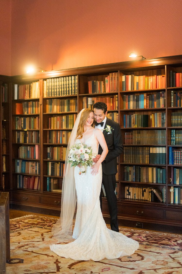Bride and groom in the library of the historic Sleepy Hollow Country club for their September wedding day.