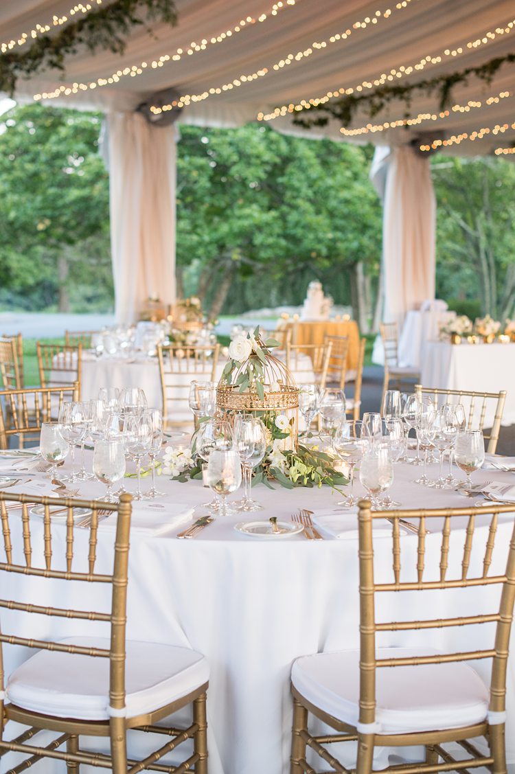 Reception table inside a fabric lined tent at Sleepy Hollow Country Club in New York.