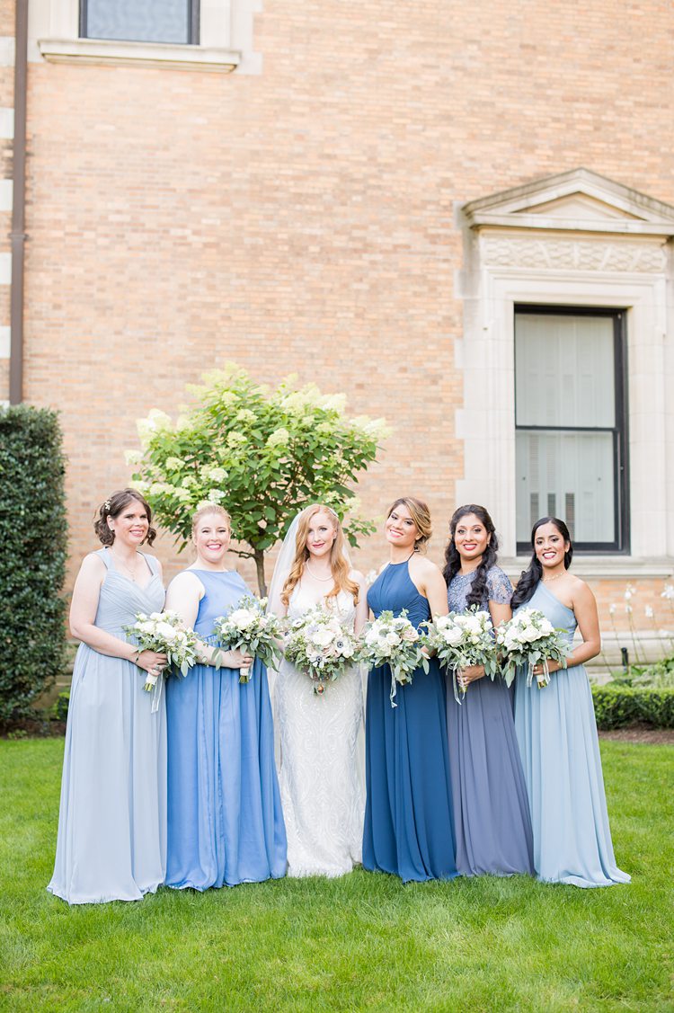 Bridesmiaids dressed in blue at a wedding at Sleepy Hollow Country Club in New York.