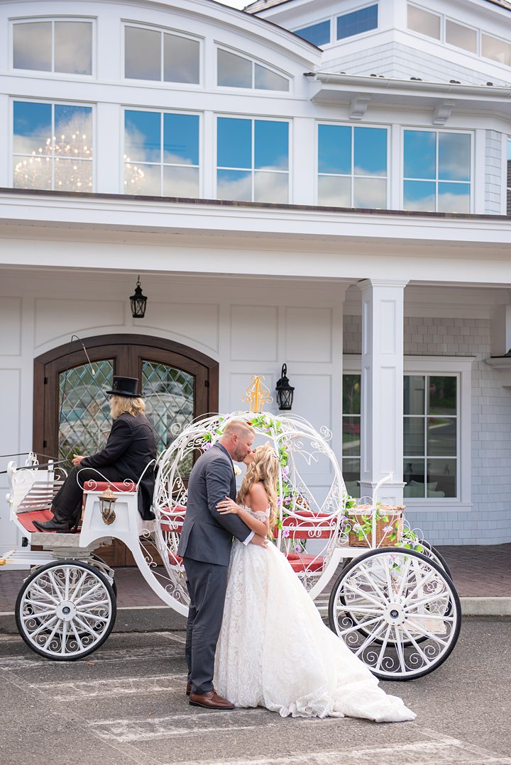 Bride and groom with a horse drawn carriage at their NJ wedding. Image by Mikkel Paige Photography.