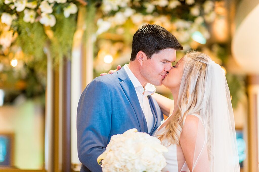 Couple kissing in The Bayou on Disney Wish in their wedding photos by Mikkel Paige Photography on Disney Cruise Line.