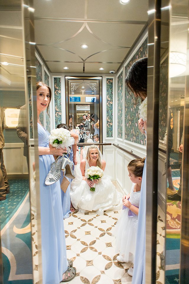 Elevator doors closing with a bride and her bridesmaids on Disney Wish. Wedding photos by Mikkel Paige Photography.