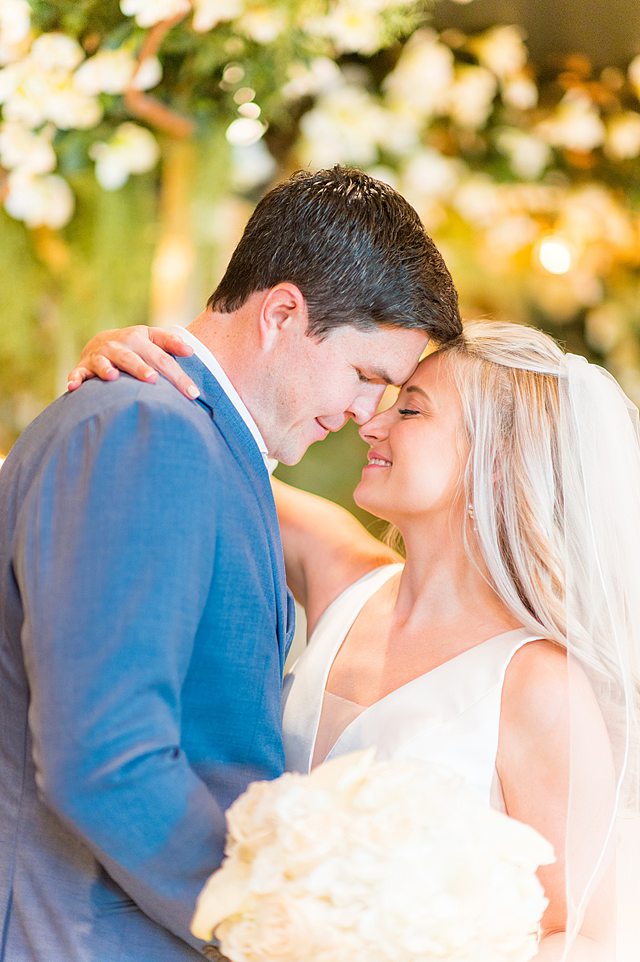 Bride and groom kiss in The Bayou during their Disney Wish wedding reception. Images by Mikkel Paige Photography.