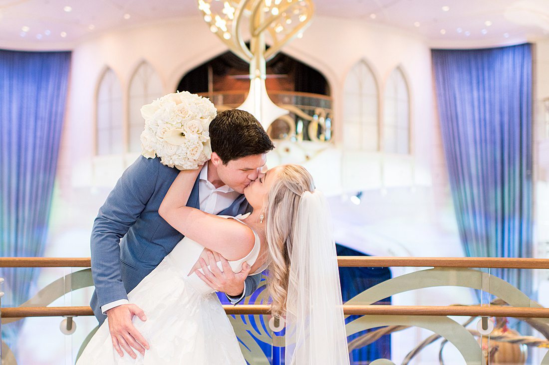 Couple kissing in their Disney Wish wedding photos on Disney Cruise Line. Image by Mikkel Paige Photography.
