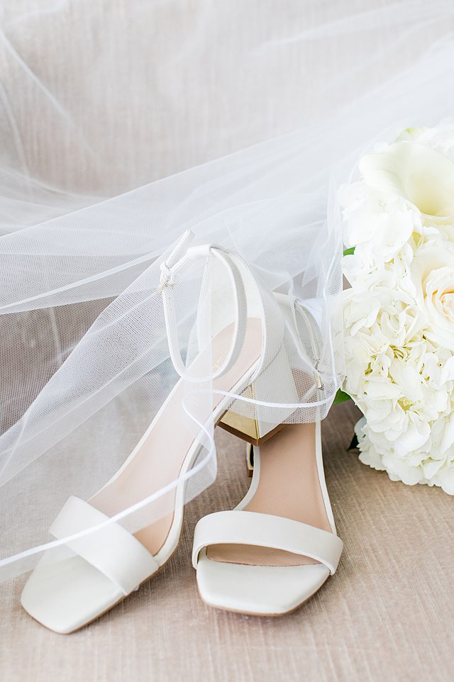 Bride's white and gold heels for a Disney Cruise Line wedding on Disney Wish with pictures by Mikkel Paige Photography.