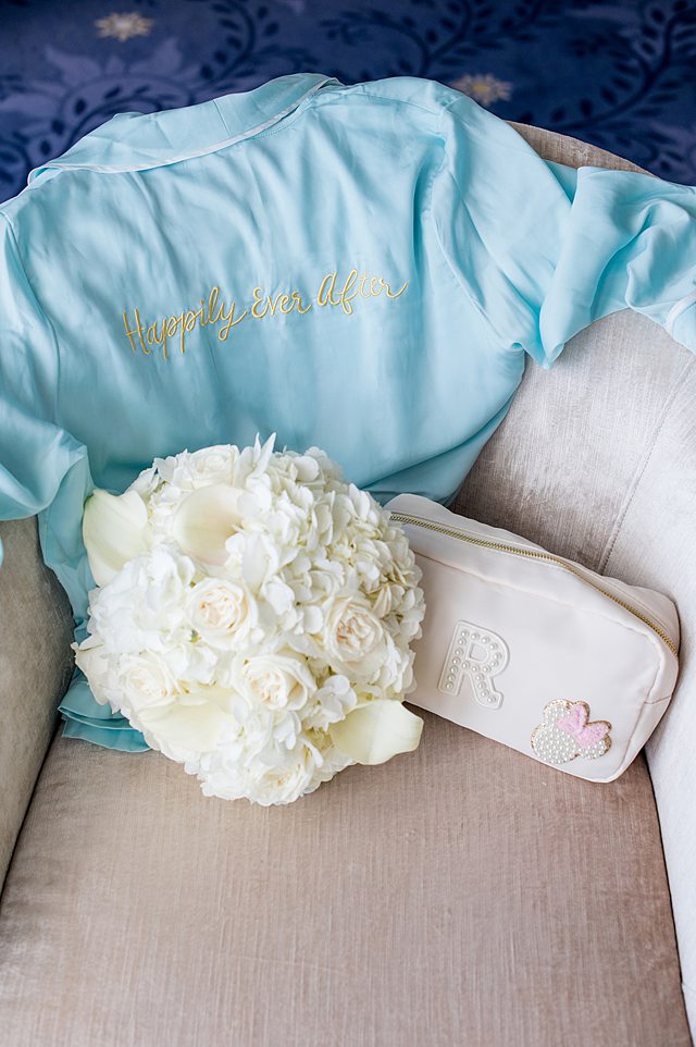 Bridal bouquet and "Happily Ever After" robe on a Disney Wish wedding with Disney Cruise Line, with photos by Mikkel Paige Photography.