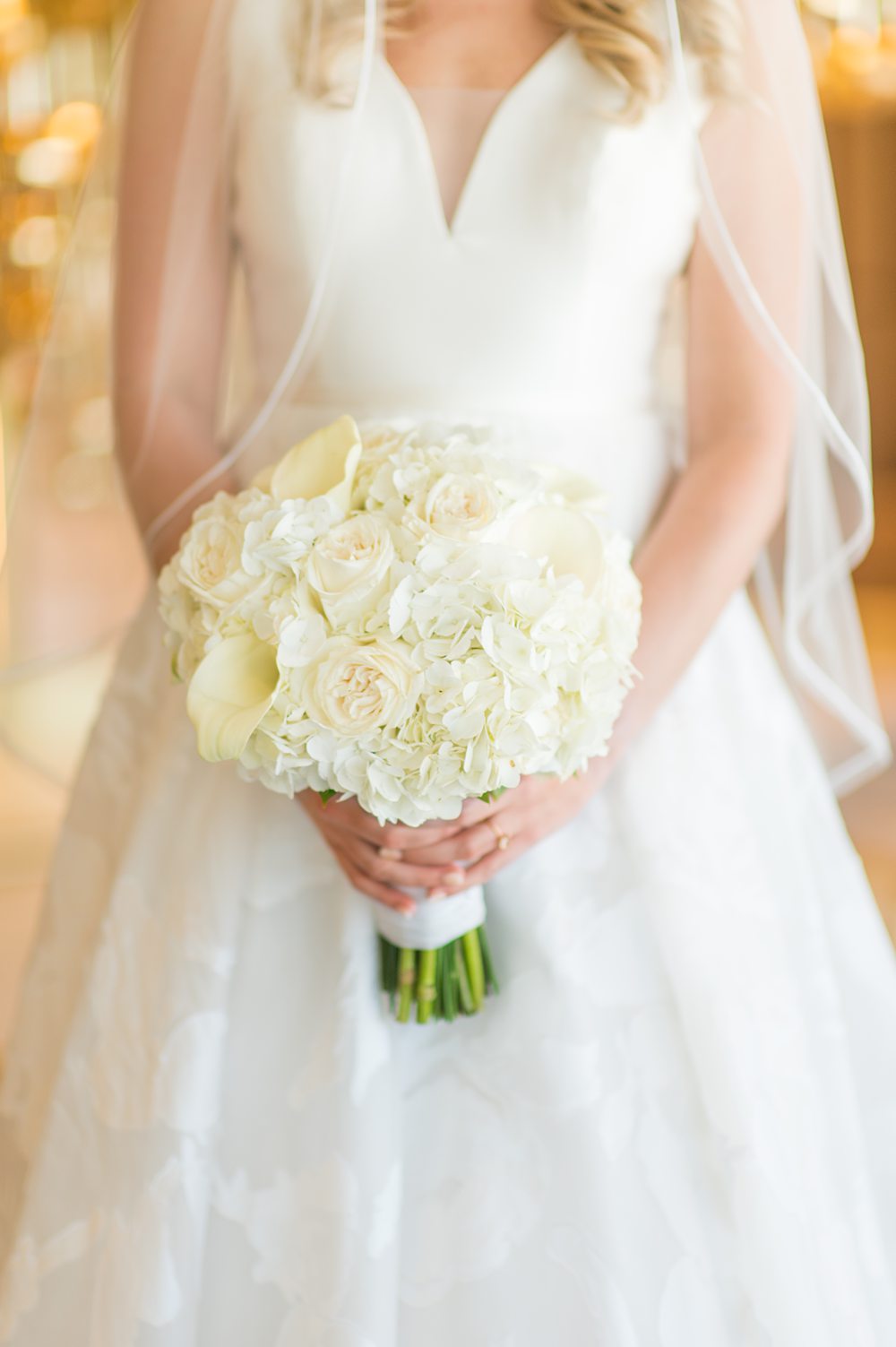 White bouquet with a bride on Disney Wish. Photos by Mikkel Paige Photography.