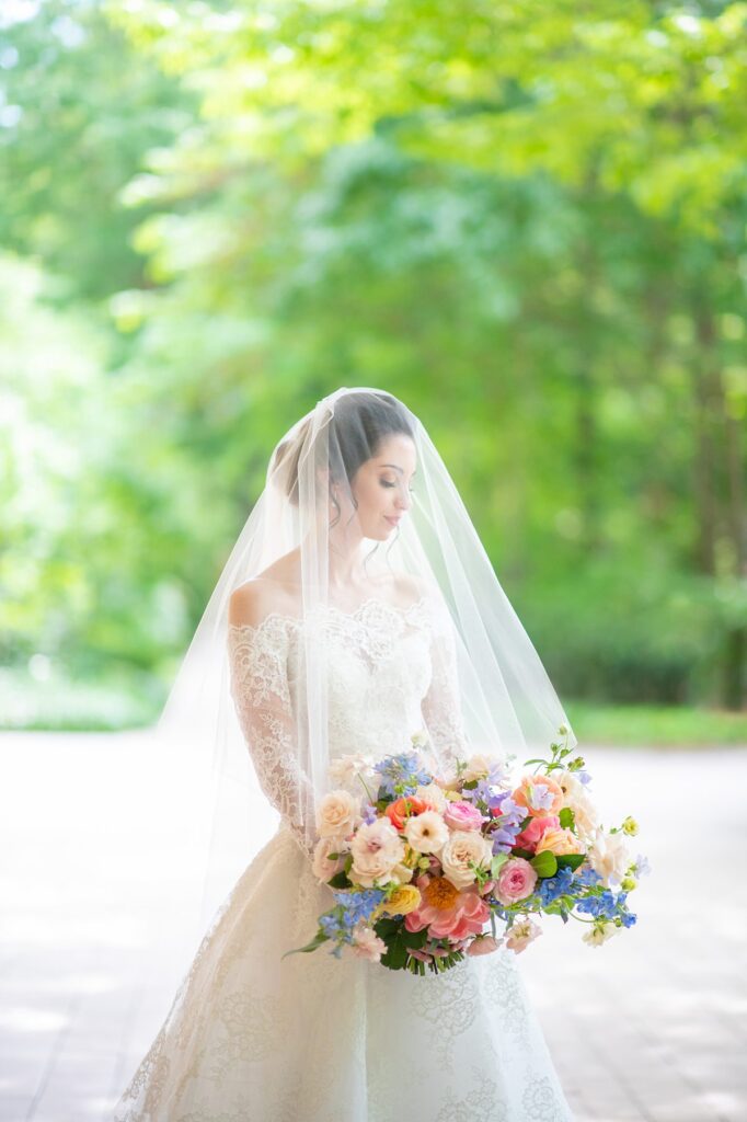 Colorful spring bouquet with sweet peas, roses, and anemones at a wedding at The Umstead Hotel and Spa in Cary, NC.