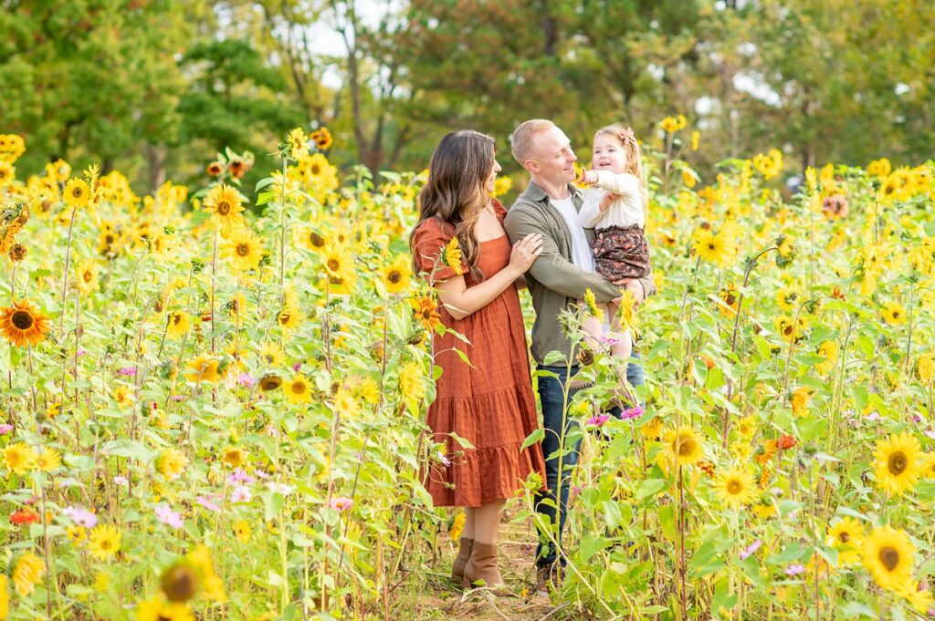 Fall family photo session in the sunflowers at NCMA in Raleigh, NC by Mikkel Paige Photography.