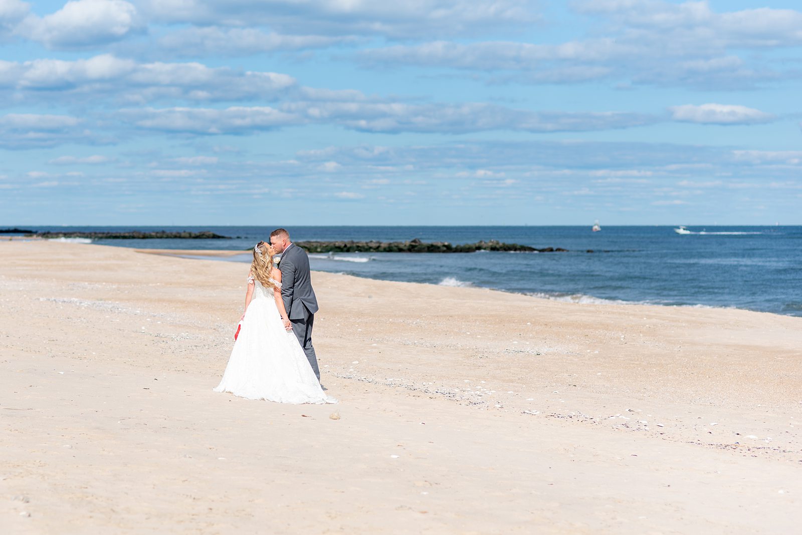 Bride and groom at the Jersey shore, NJ for a wedding near Asbury Park. Photos by Mikkel Paige Photography.