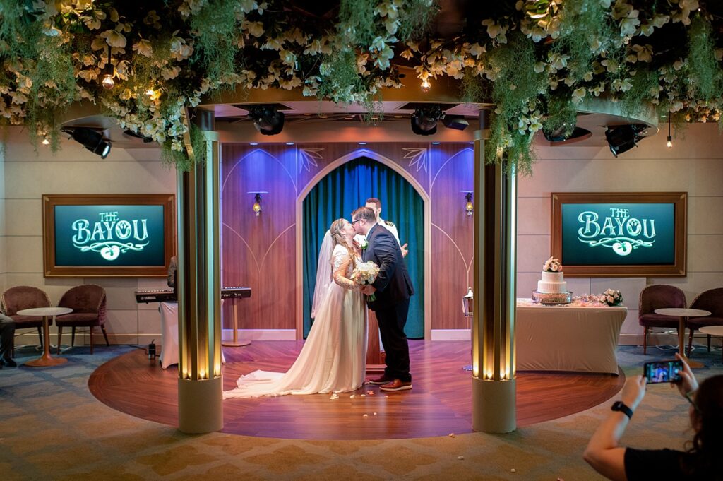 Bride and groom kidding after their wedding ceremony vows in The Bayou on Disney Wish.