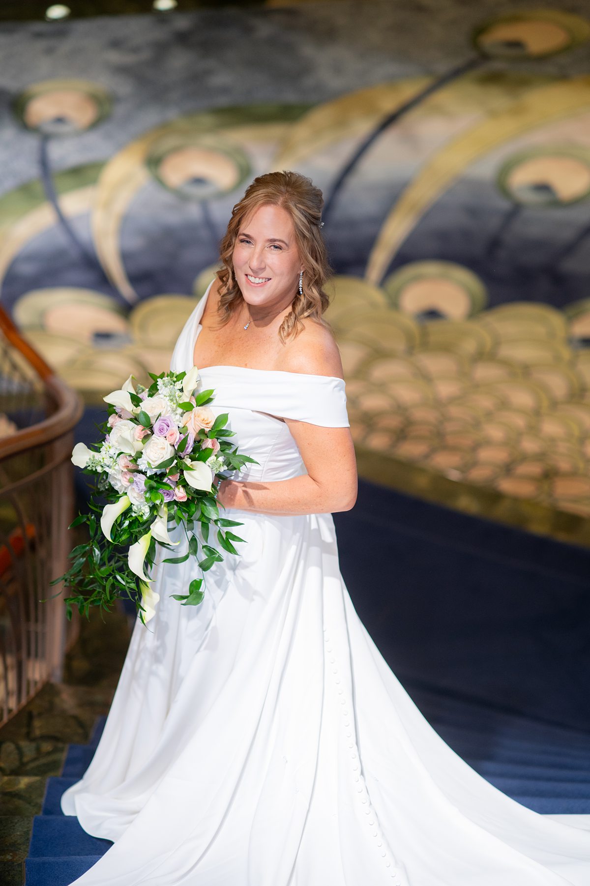 Disney Fantasy wedding with a bride on the staircase on the cruise line.